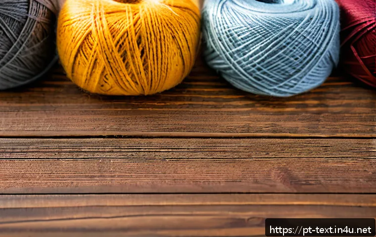 섬유기사와 시험 준비의 효과적인 방법 - A detailed close-up of various textile fibers displayed on a wooden table, showcasing natural fibers...